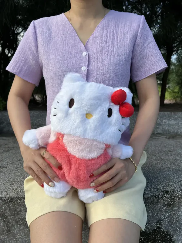 Snuggle up with the Plush Box Hello Kitty heating pad, designed to ease period cramps with gentle warmth and provide period pain relief in the cutest way possible