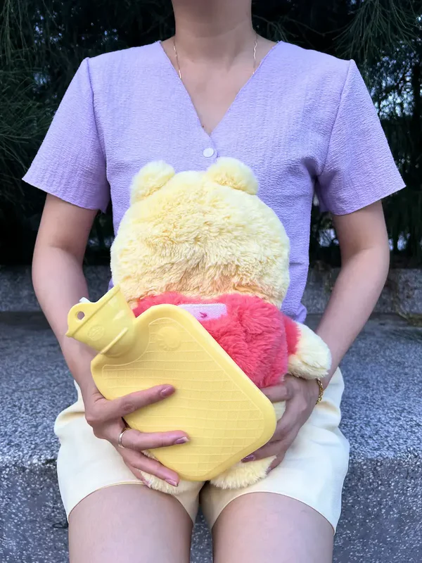 Relax with the lovable Plush Box Winnie the Pooh heating pad, perfect for period pain relief. This plush design provides soothing warmth to ease cramps and bring comfort